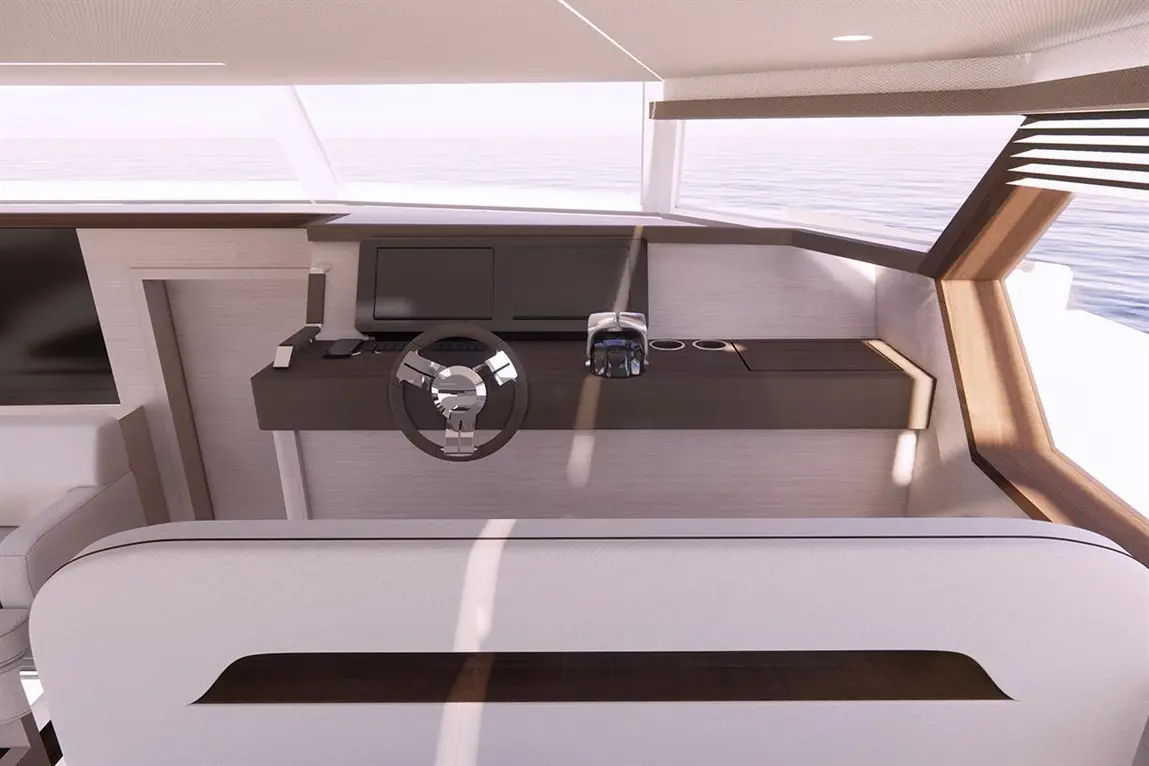 Modern yacht interior featuring a steering wheel, console with screens, and sleek sofa, bathed in natural light by large windows.